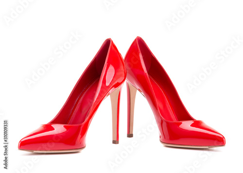 Red shoes isolate on a white background. A pair of elegant women's shoes. Beautiful red high-heeled shoes. Classic women shoes with heels.