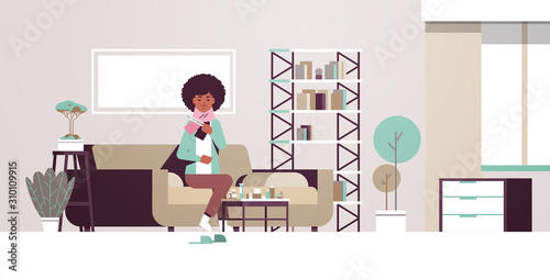 sick woman measuring temperature with thermometer unhealthy african american girl in scarf suffering from cold flu virus illness concept modern living room interior flat full length horizontal vector