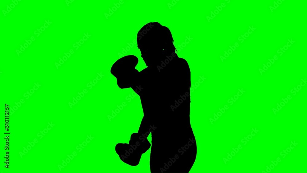 Female shadow boxer on a chroma key green background. Alpha channel is included to easily drop silhouette on a different background. Female shadow boxer on a chroma key green background. Alpha channel is included to easily drop silhouette on a different background.