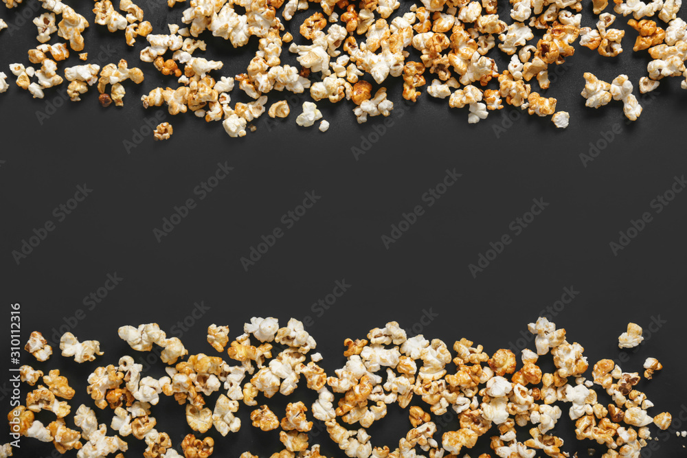 Tasty popcorn on dark background Tasty popcorn on dark background