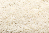 Heap of raw rice as background