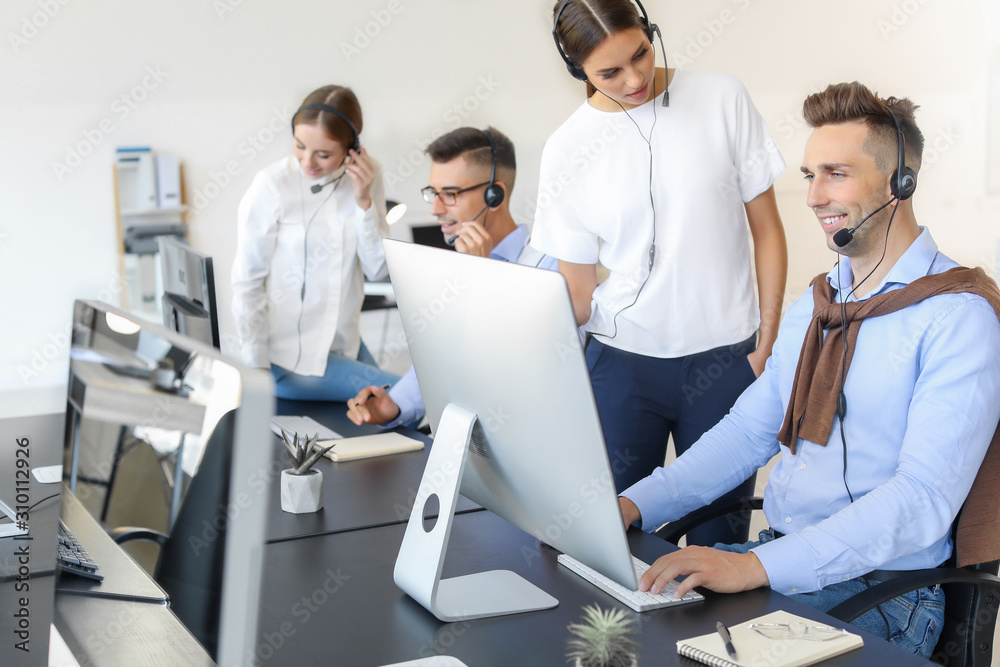 Team of technical support agents working in office Team of technical support agents working in office