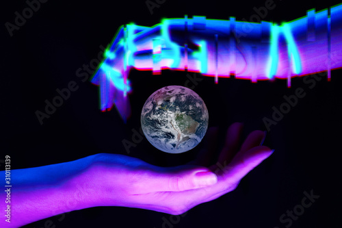 Earth between woman and robot's hands as symbol of partnership between people and technology for savety nature. Elements of this image are furnished by NASA photo