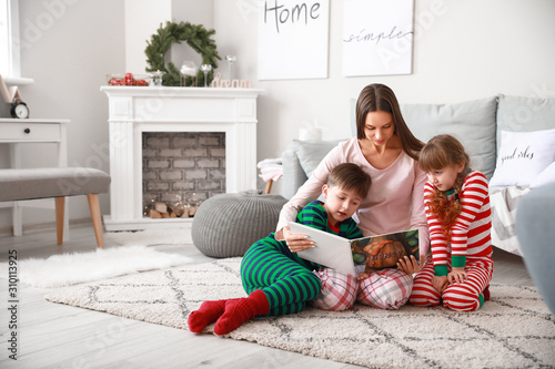 Happy family reading book a...