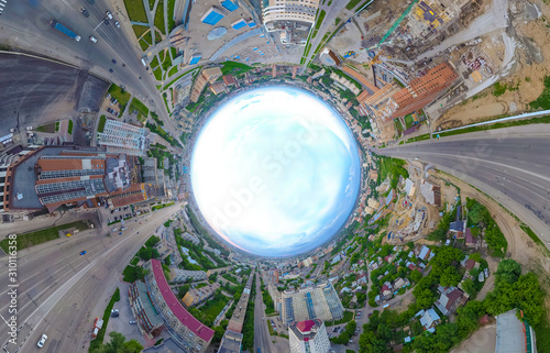 Abstract aerial view of old and new buildings with blue sky in the center in the city with a lot of cars. Russian streets, Novosibirsk.