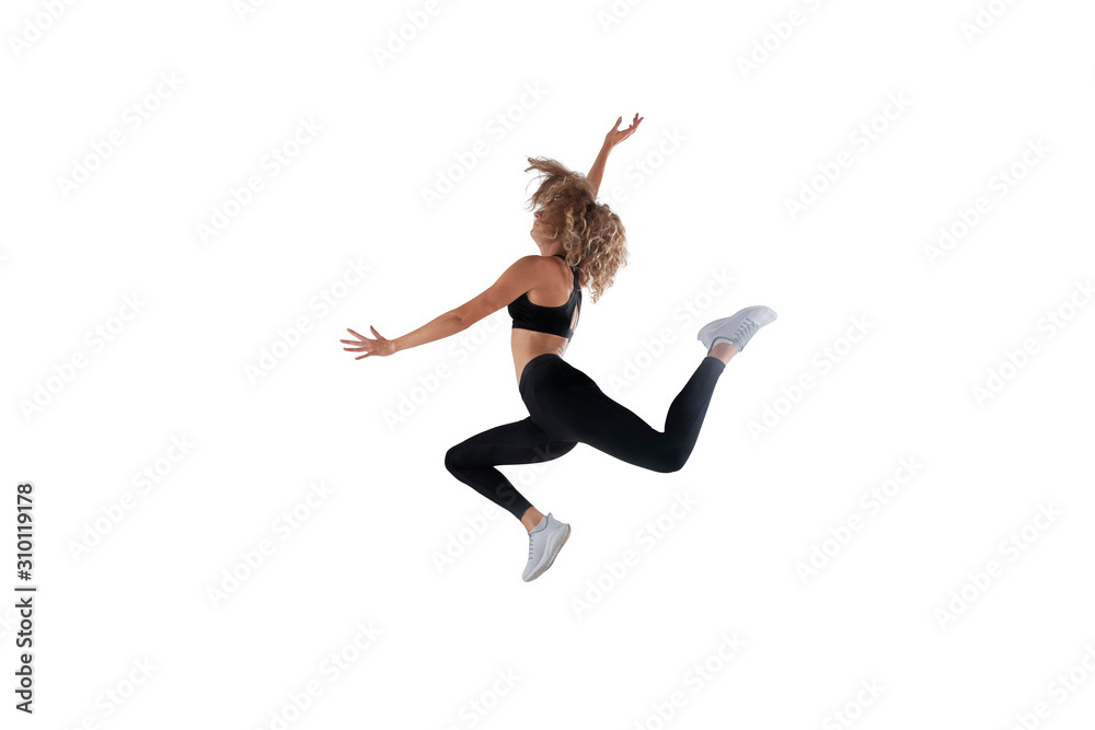 Female athlete running and jumping isolated on white.