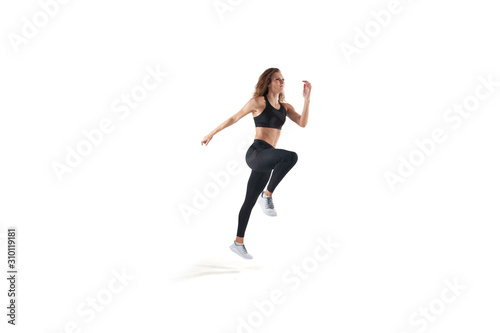 Fototapeta Naklejka Na Ścianę i Meble -  Female athlete running and jumping isolated on white.