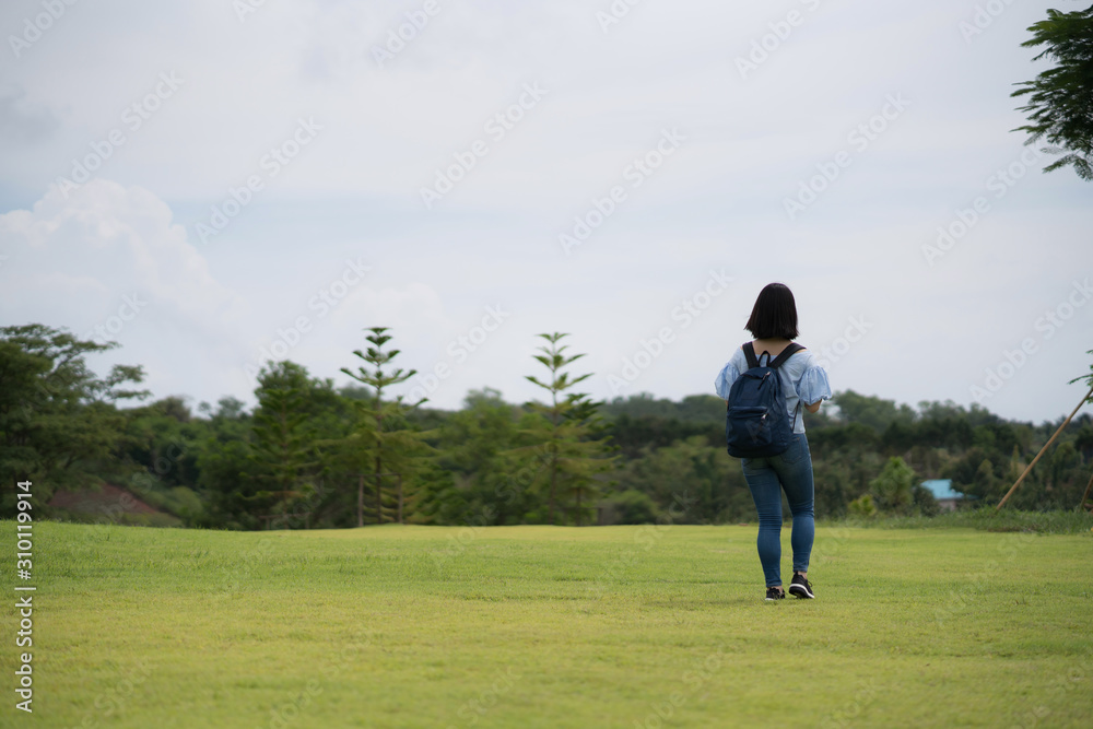 young cute Japanese Asian hipster girl travelling at beautiful sky  mountains scenery park hiking garden views at Kanchanaburi Thailand guiding idea for female backpacker woman women backpacking