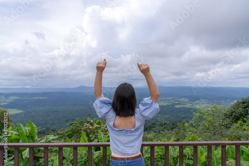 young cute Japanese Asian hipster girl travelling at beautiful sky mountains scenery park hiking garden views at Kanchanaburi Thailand guiding idea for female backpacker woman women backpacking