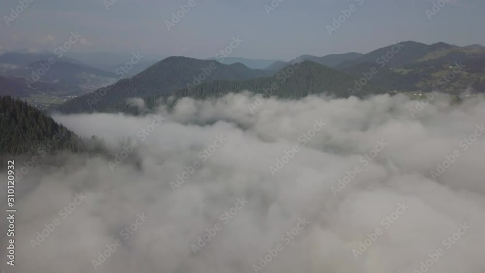 Aerial drone view of foggy sunrise over clouds hills and mountains at morning Carpathian mountains Aerial drone view of foggy sunrise over clouds hills and mountains at morning Carpathian mountains