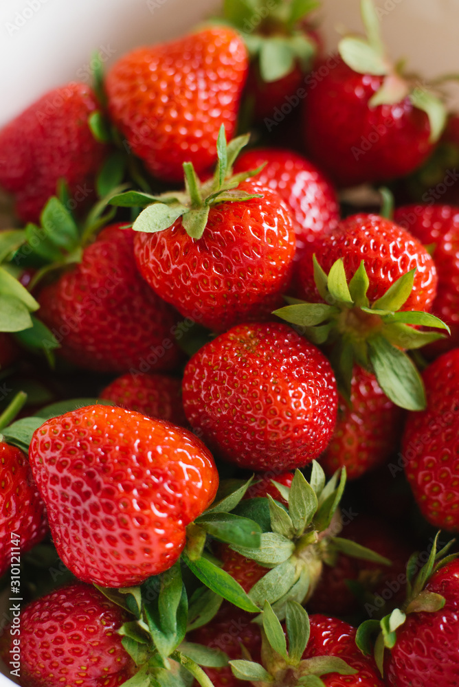 Fresh red organic strawberries closeup, background of berries Fresh red organic strawberries closeup, background of berries