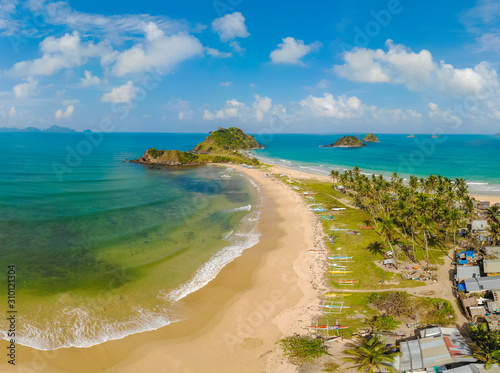 Aerial view of Nacpan Beach on paradise island  tropical travel destination  El Nido  Palawan  Philippines