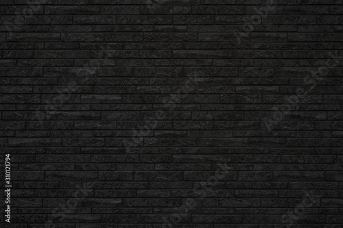 Old black brick wall texture background,brick wall texture for for interior or exterior design backdrop,vintage dark tone.