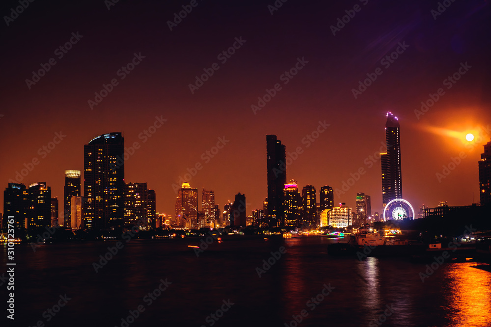 The night city of Bangkok in Thailand with the river as the center. The night city of Bangkok in Thailand with the river as the center.