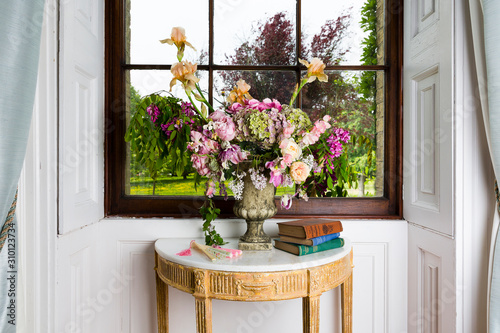 Spectacular flower arrangement in the window of a stately home.