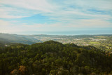 panorama of mountains with trees and clouds