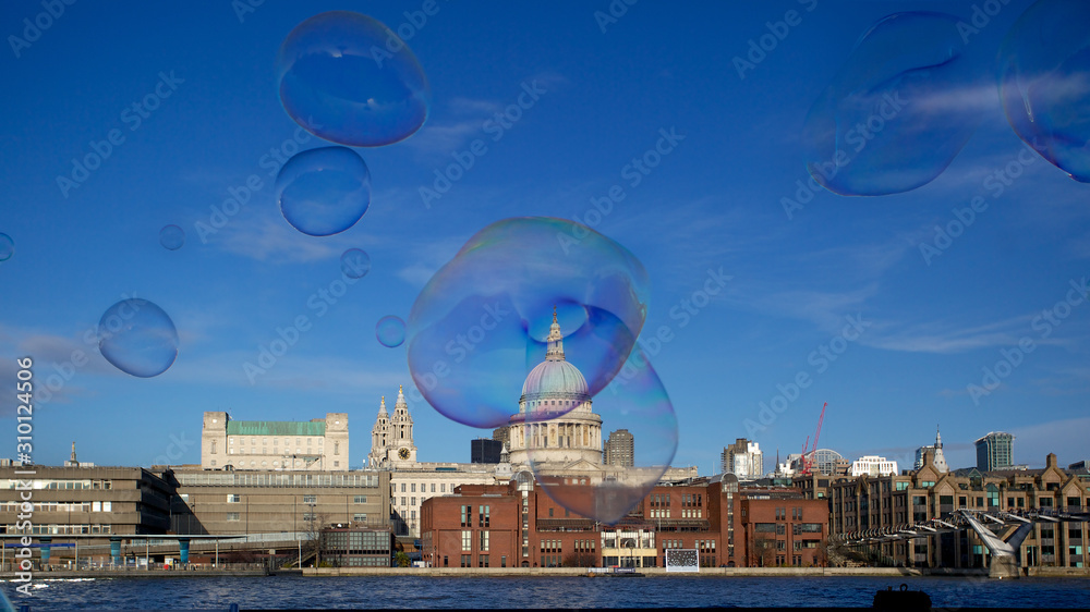 Skyline over the Thames towards St. Paul's cathedral. Soap bubbles in foreground where created by a street artist.