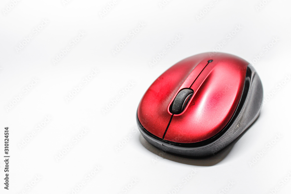 Modern red computer mouse on a white background Modern red computer mouse on a white background