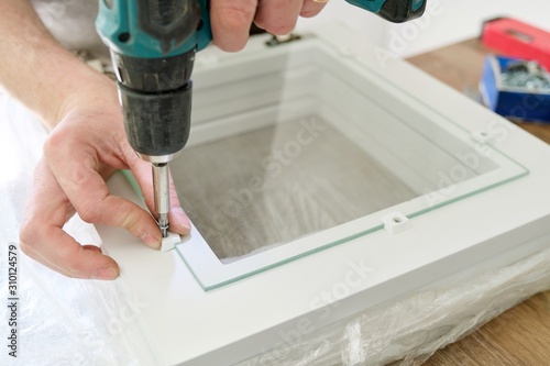 Wallpaper Mural Closeup of workers hand with professional tools and furniture details Torontodigital.ca