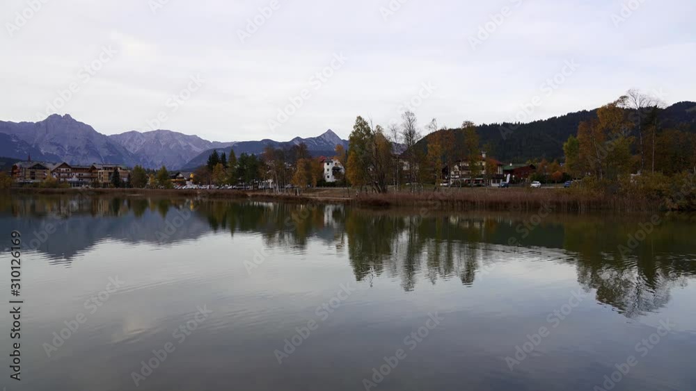 Panning shot showing epic mountains and a tranquil lake in the alps in Autumn. Wildsee, Seefeld in Tirol, Austria Panning shot showing epic mountains and a tranquil lake in the alps in Autumn. Wildsee, Seefeld in Tirol, Austria