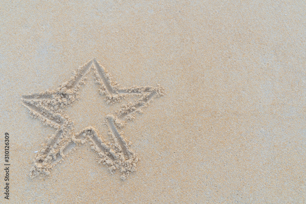 Concept Christmas on the beach Tropical design made in Phuket, Thailand Write the alphabet on the sand background Taken from real locations. Concept Christmas on the beach Tropical design made in Phuket, Thailand Write the alphabet on the sand background Taken from real locations.