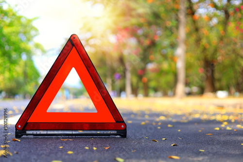 Red triangle, red emergency stop sign, red emergency symbol on road. With copy space for text or design