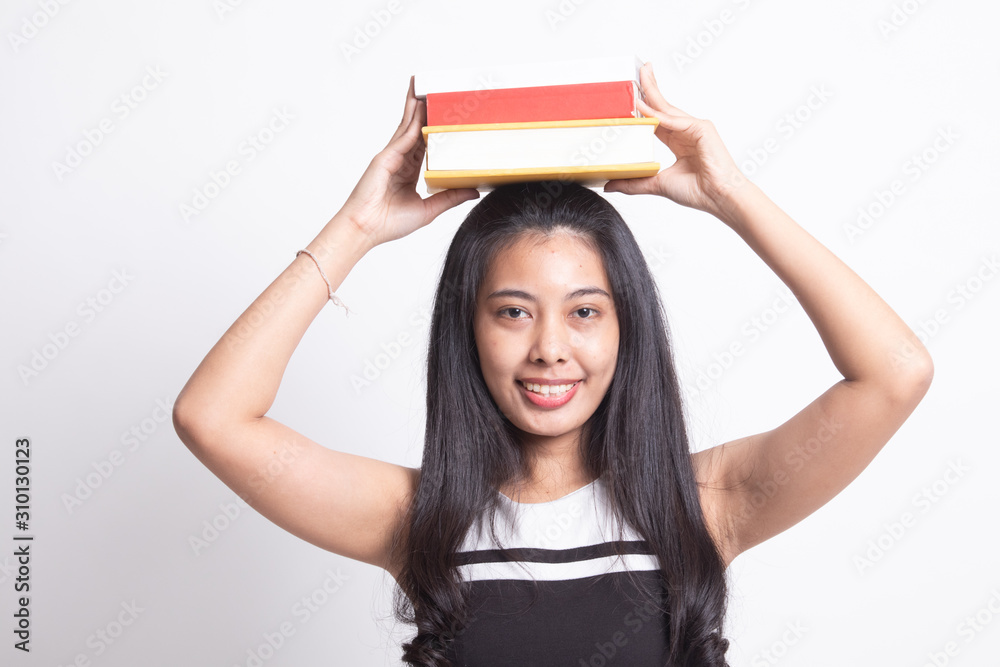 Young Asian woman studying with may books Young Asian woman studying with may books