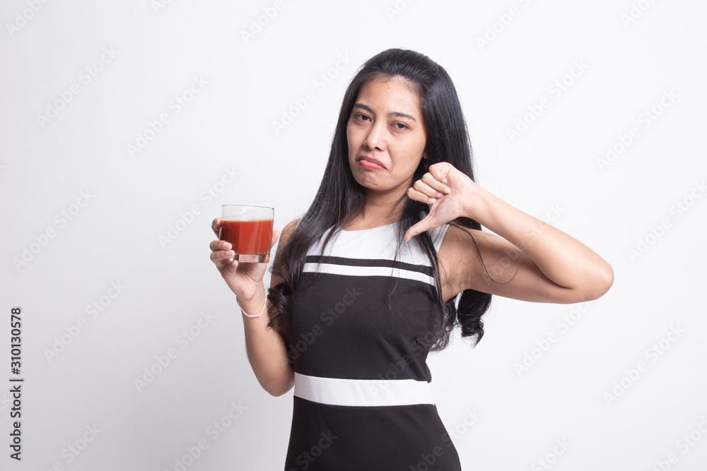 Asian woman thumbs down hate tomato juice Asian woman thumbs down hate tomato juice