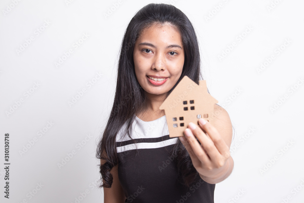 Happy young asian woman with house model Happy young asian woman with house model