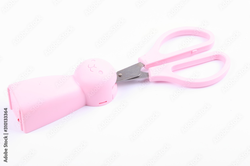 Pink scissors with pink cover isolated on white Pink scissors with pink cover isolated on white