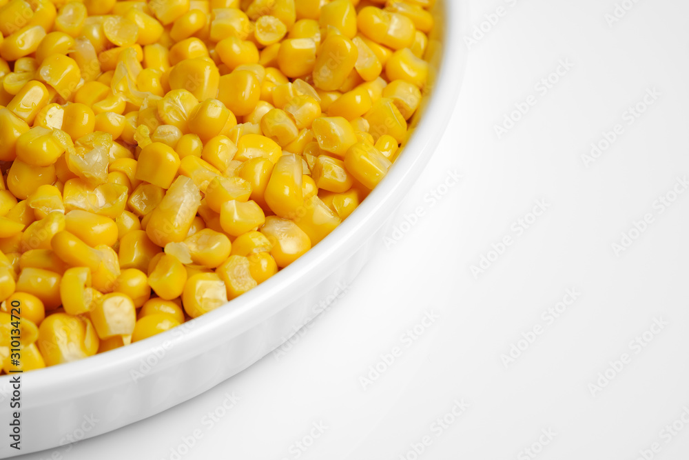 canned corn in white plate top view. white background closeup canned corn in white plate top view. white background closeup