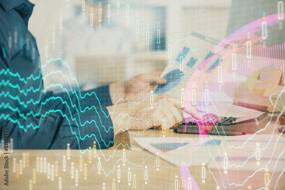 Double exposure of graph with man typing on computer in office on background. Concept of hard work. Closeup. Double exposure of graph with man typing on computer in office on background. Concept of hard work. Closeup.