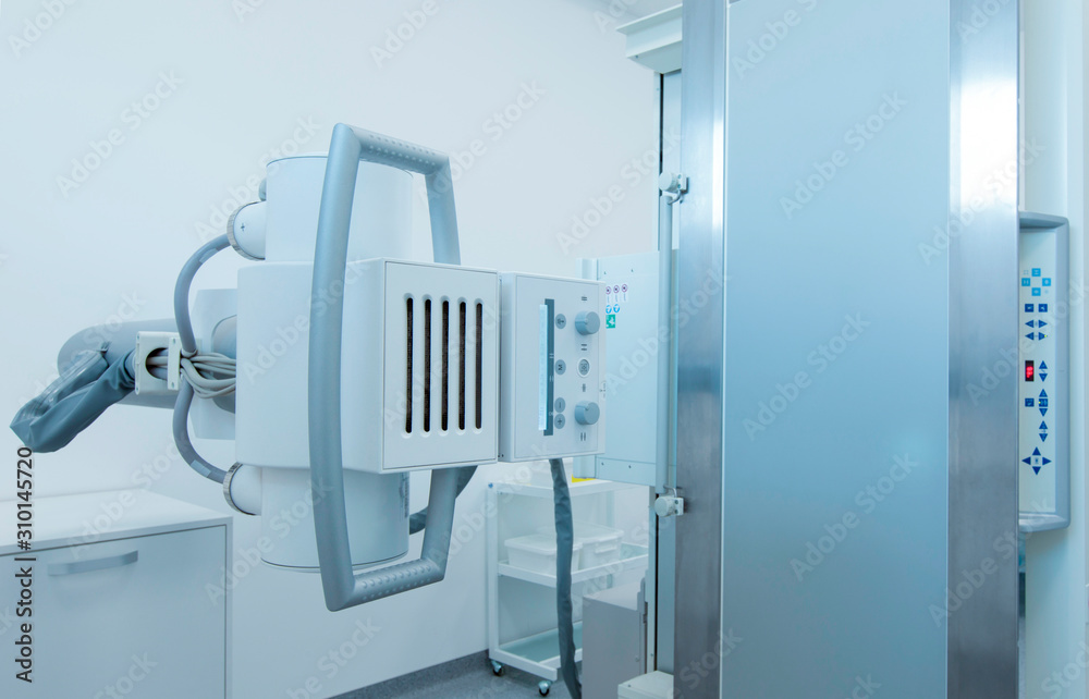 High quality X-ray machine in light medical room High quality X-ray machine in light medical room