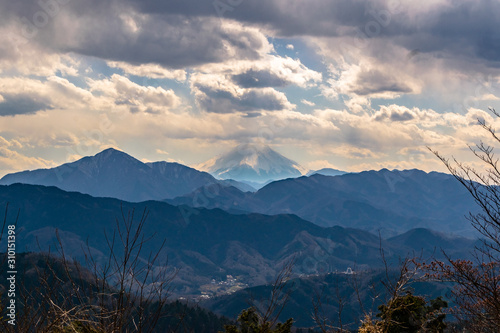 Fototapeta Naklejka Na Ścianę i Meble -  Mount Fuji seen from Mount Takao in spring with clouds