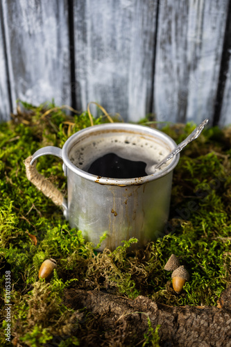 Vintage coffee mug in moss