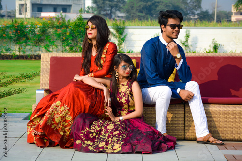 Young Siblings together Posing For Traditional Indian Wedding Photo Shoot.