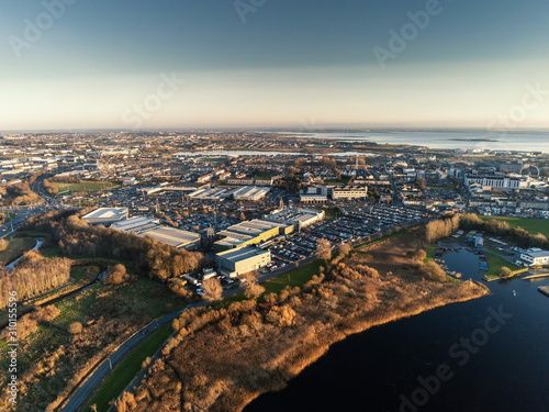Aerial view on Galway city, Ireland, Shopping centers, car park, river Corrib.