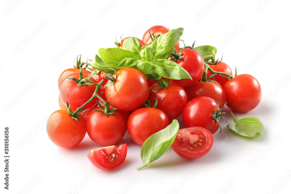 Group of ripe red cherry tomatos and basil isolated on white background Group of ripe red cherry tomatos and basil isolated on white background