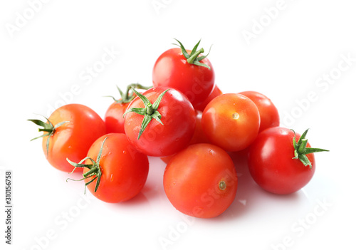 Ripe red cherry tomatos isolated on white background photo