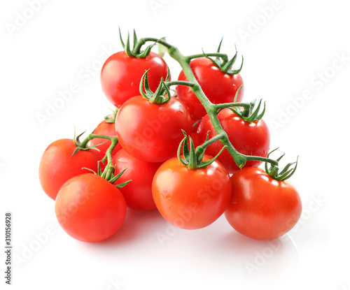 Branches of red ripe tomatoes isolated on white background