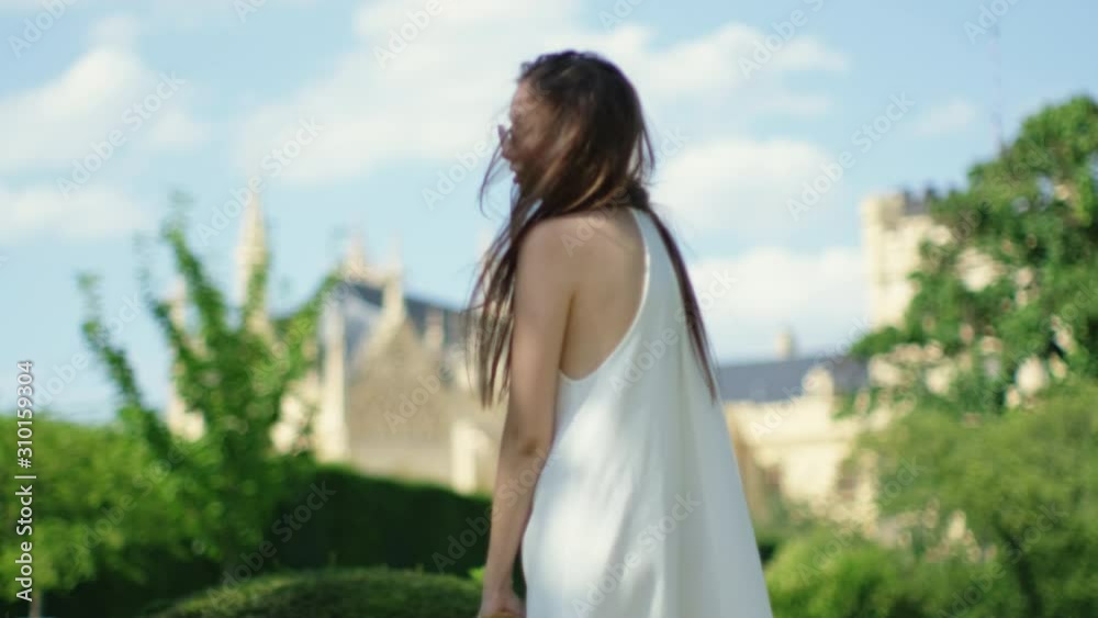 Girl against Lednice Palace in Czechia Girl against Lednice Palace in Czechia