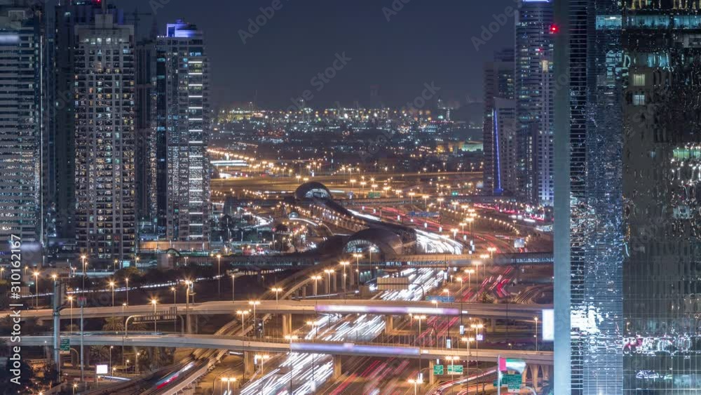 Dubai Marina and JLT aerial night timelapse top view of skyscrapers in Dubai, UAE. Modern towers and traffic on sheikh zayed road and metro line Dubai Marina and JLT aerial night timelapse top view of skyscrapers in Dubai, UAE. Modern towers and traffic on sheikh zayed road and metro line