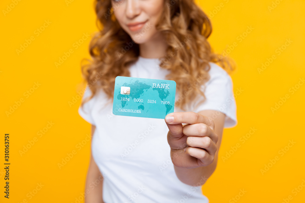 Closeup photo of woman with credit card isolated Closeup photo of woman with credit card isolated