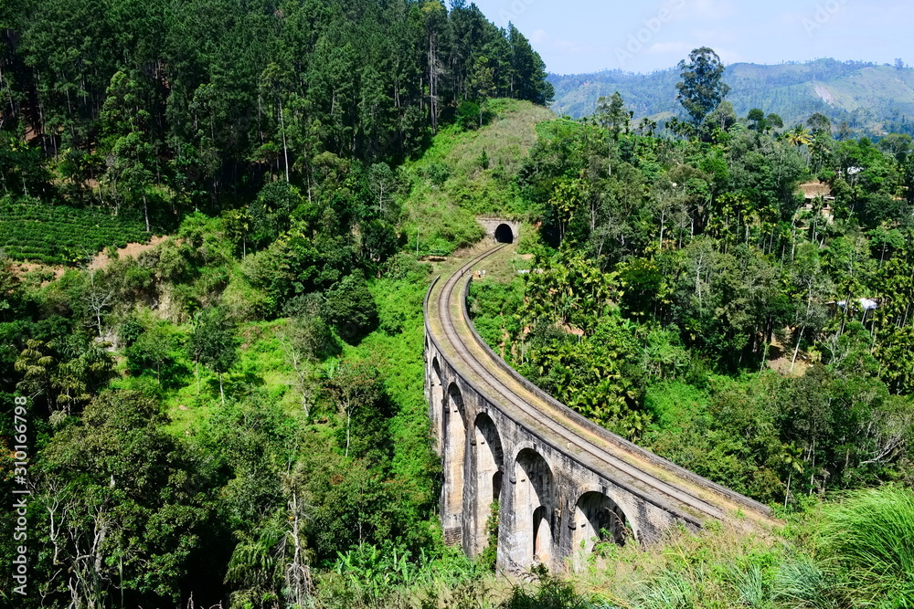 The Nine Arches Bridge in Demodara - one of the most famous old stone bridge in colonial style built by the British. Popular travel destination in Ella, Sri Lanka