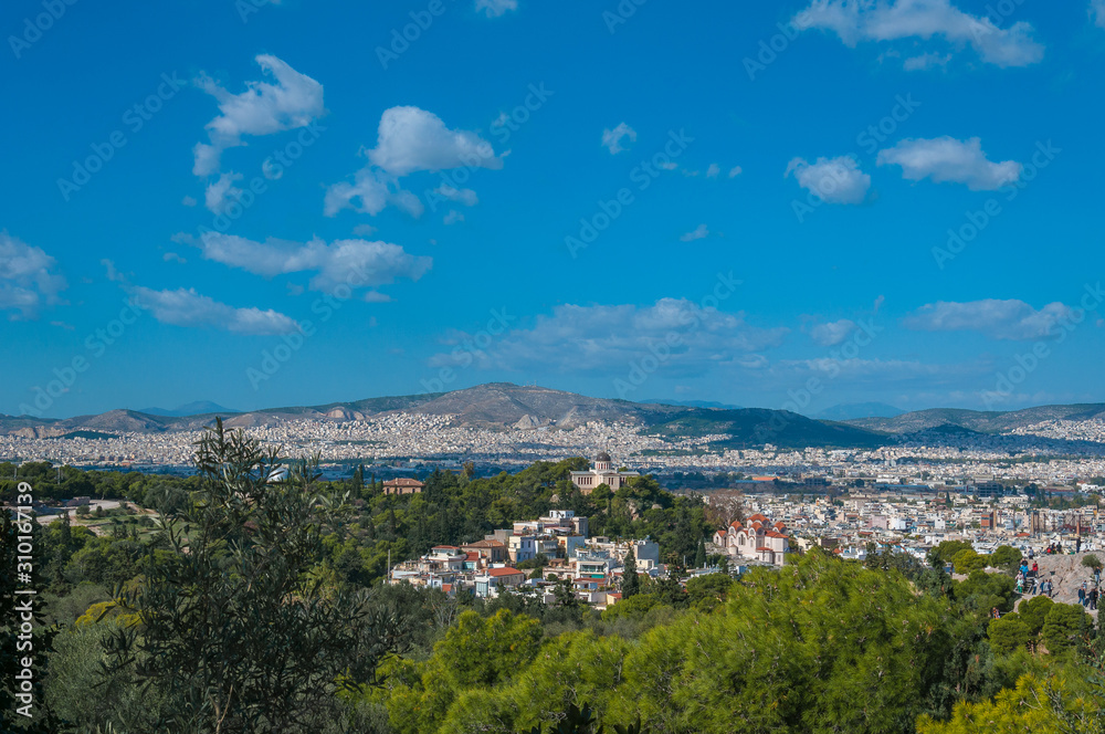 Beautiful panorama of the city of Athens seen from the Acropolis, Greece. Concept: classical culture, famous monuments, ancient history, cultural travel, visiting unesco world heritage