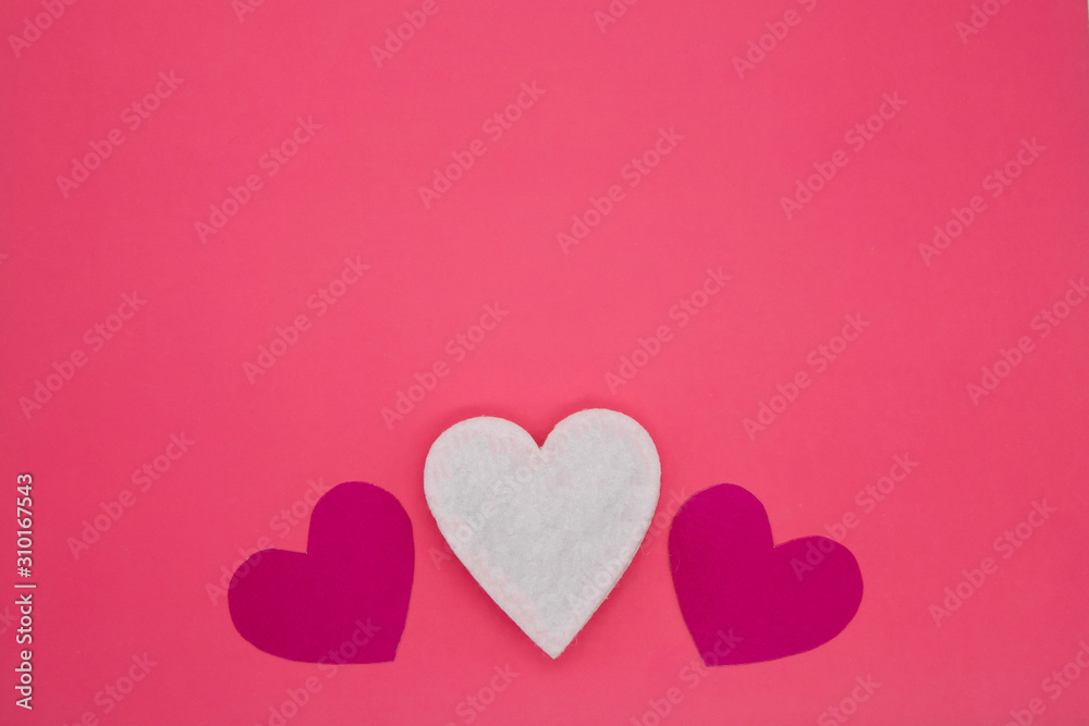 valentines day background with five hearts on pink background
