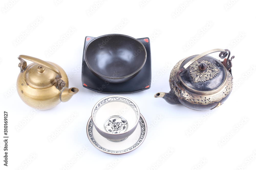 set of Ancient teapot,Teacup and Saucer on white background set of Ancient teapot,Teacup and Saucer on white background