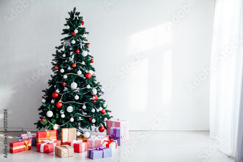 Christmas tree with presents, Garland lights new year winter home decoration © dmitriisimakov