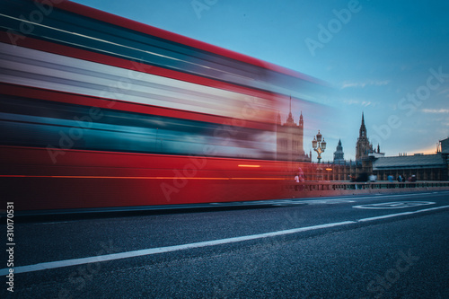 Fototapeta Scene of Westminster Bridge seen from South Bank, quiet morning double decker bus and fast moving