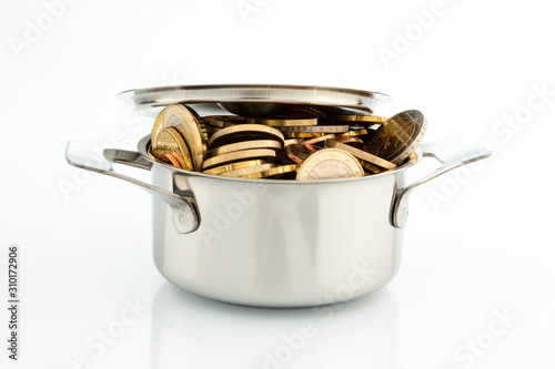 a cooking pot is well filled with euro coins, symbolic picture for subsidies photo